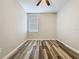 Bright bedroom features hardwood floors and a ceiling fan at 9824 Secret Cove Ln, Orlando, FL 32832