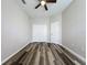 This bedroom has a ceiling fan, a closet, and hardwood flooring at 9824 Secret Cove Ln, Orlando, FL 32832
