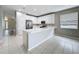 Modern kitchen with white cabinetry, stainless steel appliances, and spacious island countertop at 9824 Secret Cove Ln, Orlando, FL 32832
