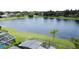 A stunning, expansive view of the lake beyond the screened patio and lawn at 9824 Secret Cove Ln, Orlando, FL 32832