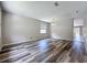Spacious living room featuring modern wood flooring and neutral paint at 9824 Secret Cove Ln, Orlando, FL 32832