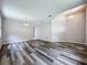 Open-plan living area featuring hard surface flooring and high ceilings at 9824 Secret Cove Ln, Orlando, FL 32832
