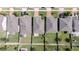 A birdseye view featuring a home with green backyard, gray roof, and well-organized neighborhood at 1021 Golden Dawn Loop, Minneola, FL 34715