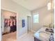 Bathroom features granite countertops, dual sinks and walk-in closet access at 1021 Golden Dawn Loop, Minneola, FL 34715