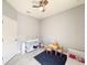 Spacious bedroom with closet, ceiling fan and tile flooring at 1021 Golden Dawn Loop, Minneola, FL 34715
