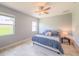 Bright bedroom with neutral walls, natural light, and cozy decor elements for a relaxing atmosphere at 1021 Golden Dawn Loop, Minneola, FL 34715