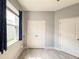 Bedroom features a neutral palette, closet space, and light wood-look floors at 1021 Golden Dawn Loop, Minneola, FL 34715