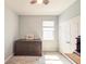 Bright bedroom featuring light gray walls, natural light, and a ceiling fan at 1021 Golden Dawn Loop, Minneola, FL 34715
