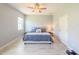 Bedroom featuring neutral walls, modern decor, and a ceiling fan for optimal comfort at 1021 Golden Dawn Loop, Minneola, FL 34715
