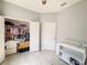 Bedroom features a neutral palette, closet space, and light wood-look floors at 1021 Golden Dawn Loop, Minneola, FL 34715