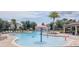 A community pool features various water features, seating, and a covered picnic area at 1021 Golden Dawn Loop, Minneola, FL 34715