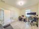 Large office features wood-look floors, french doors and plenty of desk space at 1021 Golden Dawn Loop, Minneola, FL 34715