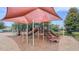 Community playground with slides, climbing structures, and a soft, mulch-covered ground for safety at 1021 Golden Dawn Loop, Minneola, FL 34715