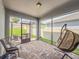 Enjoy outdoor living in this screened patio with brick pavers and relaxing seating at 1021 Golden Dawn Loop, Minneola, FL 34715