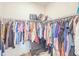 Walk-in closet includes shelving, hanging rods and drawers for ample storage at 1021 Golden Dawn Loop, Minneola, FL 34715
