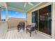Relaxing balcony space with cozy seating and picturesque views, perfect for enjoying the outdoors at 114 Harwood Cir, Kissimmee, FL 34744