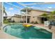 Spacious screened-in pool area with multiple lounge chairs and a view of the home's upper balcony at 114 Harwood Cir, Kissimmee, FL 34744