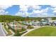 Aerial view of community amenities, including playground and pool with lush landscaping at 11844 Founders St, Orlando, FL 32832