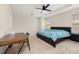 Bright bedroom with a ceiling fan, plush carpeting, and space for a desk and cozy decor at 11844 Founders St, Orlando, FL 32832