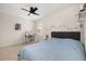 Bright bedroom featuring cozy decor, plush carpeting, and a modern ceiling fan at 11844 Founders St, Orlando, FL 32832