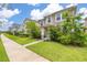 Street view of elegant homes with manicured lawns, sidewalks, and lush landscaping at 11844 Founders St, Orlando, FL 32832