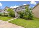 Charming two-story home with a lush lawn and meticulously maintained landscaping at 11844 Founders St, Orlando, FL 32832