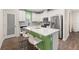 Beautiful kitchen featuring stainless appliances, white cabinets, and large island at 11844 Founders St, Orlando, FL 32832