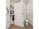 Convenient mud room with built-in storage shelves, hooks, and tiled floors at 11844 Founders St, Orlando, FL 32832