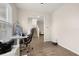 Home office with wood-look floors and access to the upstairs and downstairs at 11844 Founders St, Orlando, FL 32832