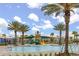 A large community pool area featuring palm trees and a ' splash zone at 11844 Founders St, Orlando, FL 32832