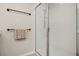 Clean shower featuring a frameless glass enclosure, white tiling, and modern fixtures at 11844 Founders St, Orlando, FL 32832