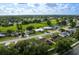 Neighborhood aerial view showcasing the homes, green spaces, and picturesque surroundings at 12542 Idaho Woods Ln, Orlando, FL 32824