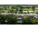Aerial perspective of homes with green landscapes and neighborhood streets at 12542 Idaho Woods Ln, Orlando, FL 32824