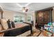 Bedroom featuring natural light from a large window and a decorative rug at 12542 Idaho Woods Ln, Orlando, FL 32824