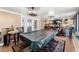 Spacious game room with pool table, bar, entertainment area, and stylish lighting at 12542 Idaho Woods Ln, Orlando, FL 32824