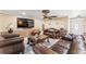 Well-decorated living room featuring comfortable seating, ceiling fan and lots of space at 12542 Idaho Woods Ln, Orlando, FL 32824