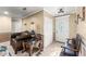 Spacious living room featuring neutral paint, elegant furnishings and tile flooring throughout at 12542 Idaho Woods Ln, Orlando, FL 32824