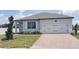 Charming single-story home featuring a two-car garage, well-kept lawn, and inviting curb appeal at 1292 Hilltop Pl, St Cloud, FL 34772