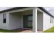Covered patio with a brick floor and sliding glass doors at 1292 Hilltop Pl, St Cloud, FL 34772