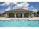 Community pool area with covered seating and clear blue water at 1292 Hilltop Pl, St Cloud, FL 34772
