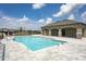 Beautiful community pool area with shaded seating and manicured landscaping at 1292 Hilltop Pl, St Cloud, FL 34772