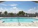 Gorgeous view of the community pool area with bright blue skies at 1292 Hilltop Pl, St Cloud, FL 34772
