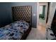 Bedroom with a decorative headboard and a view of a hallway with a bicycle at 153 Taft Dr, Davenport, FL 33837