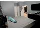 Large bedroom with a gray walls, tv, and access to other rooms at 153 Taft Dr, Davenport, FL 33837