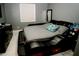 Modern bedroom with an unique platform bed, sleek dresser, and gray walls at 153 Taft Dr, Davenport, FL 33837