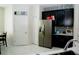 Well-lit kitchen featuring stainless steel appliances, white cabinets, and white countertops, and ceramic tile floors at 153 Taft Dr, Davenport, FL 33837
