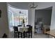 Inviting breakfast nook bathed in natural light, adjacent to the living room area at 216 Boxwood Dr, Davenport, FL 33837
