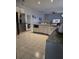 Well-equipped kitchen with stainless steel appliances, white cabinets, and ample counter space at 216 Boxwood Dr, Davenport, FL 33837