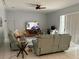 Spacious living room with comfortable seating, a ceiling fan, and a sliding glass door at 216 Boxwood Dr, Davenport, FL 33837