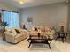 Cozy living room featuring plush seating, decorative pillows, and an inviting atmosphere at 216 Boxwood Dr, Davenport, FL 33837